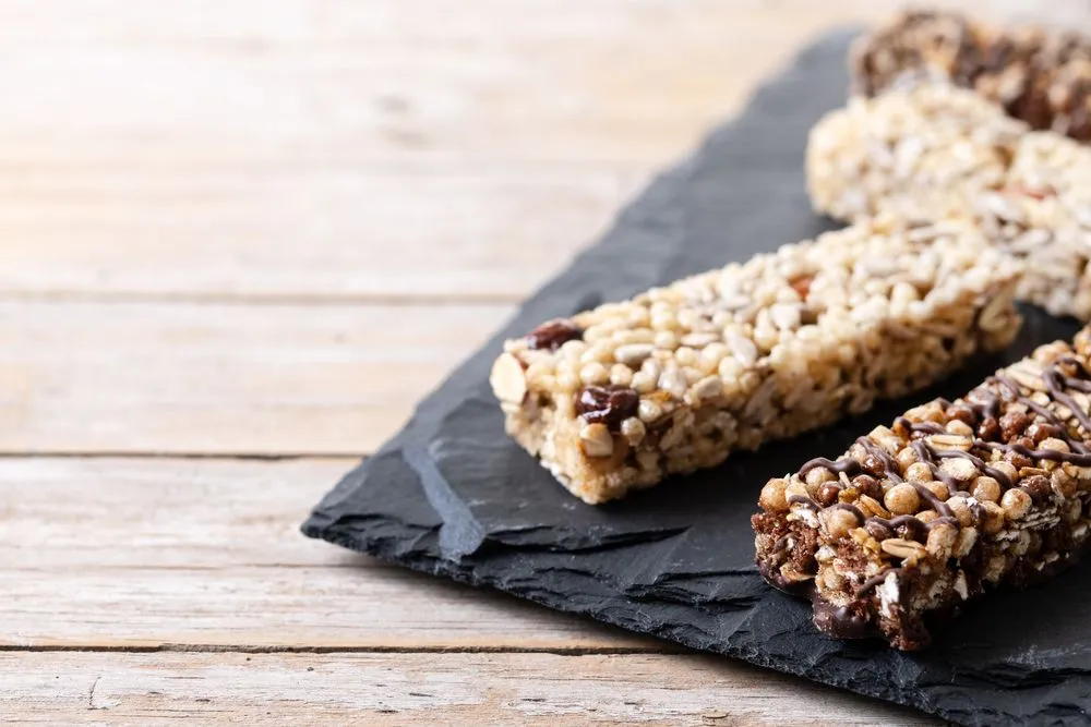 healthy-muesli-bars-with-nut-black-chocolate-wooden-table.jpg?format=webp